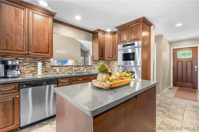 164 Get A Way Ln, Camdenton, MO 65020 - kitchen featuring stainless steel appliances, tasteful backsplash, recessed lighting, and a center island