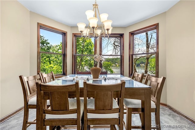 164 Get A Way Ln, Camdenton, MO 65020 - dining area featuring a chandelier and baseboards