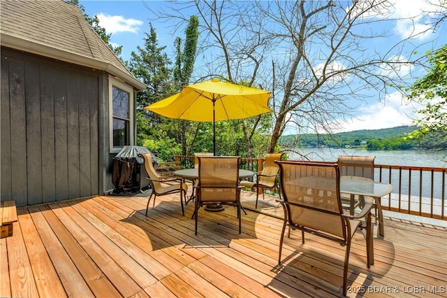 164 Get A Way Ln, Camdenton, MO 65020 - wooden deck with outdoor dining area and a water view