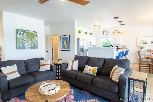 418 Regatta Bay Dr Unit 4A, Lake Ozark, MO 65049 - living area featuring ceiling fan and light wood-type flooring