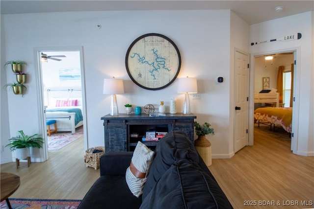 418 Regatta Bay Dr Unit 4A, Lake Ozark, MO 65049 - living room featuring light wood-style flooring and a ceiling fan