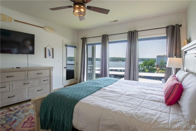 418 Regatta Bay Dr Unit 4A, Lake Ozark, MO 65049 - bedroom with access to outside, multiple windows, a water view, and ceiling fan