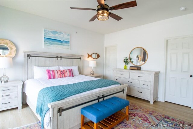 418 Regatta Bay Dr Unit 4A, Lake Ozark, MO 65049 - bedroom featuring light wood finished floors and a ceiling fan