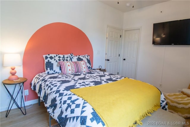 418 Regatta Bay Dr Unit 4A, Lake Ozark, MO 65049 - bedroom with wood finished floors and baseboards