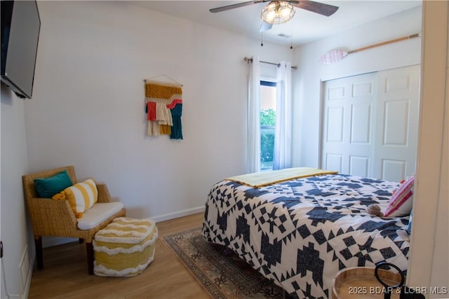418 Regatta Bay Dr Unit 4A, Lake Ozark, MO 65049 - bedroom with wood finished floors, a closet, and a ceiling fan