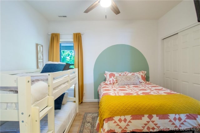 418 Regatta Bay Dr Unit 4A, Lake Ozark, MO 65049 - bedroom with wood finished floors, a closet, and a ceiling fan