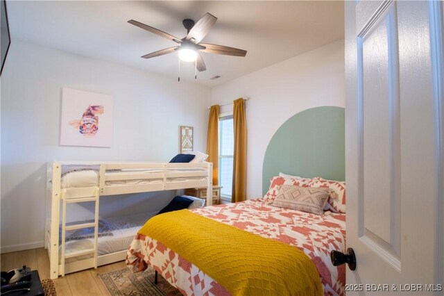 418 Regatta Bay Dr Unit 4A, Lake Ozark, MO 65049 - bedroom with wood finished floors and a ceiling fan