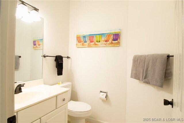 418 Regatta Bay Dr Unit 4A, Lake Ozark, MO 65049 - half bathroom featuring vanity and toilet