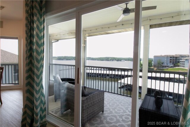 418 Regatta Bay Dr Unit 4A, Lake Ozark, MO 65049 - balcony featuring a water view and a ceiling fan