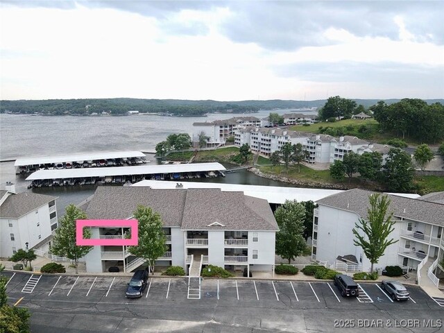 418 Regatta Bay Dr Unit 4A, Lake Ozark, MO 65049 - aerial view of property and surrounding area with a large body of water and property boundaries highlighted
