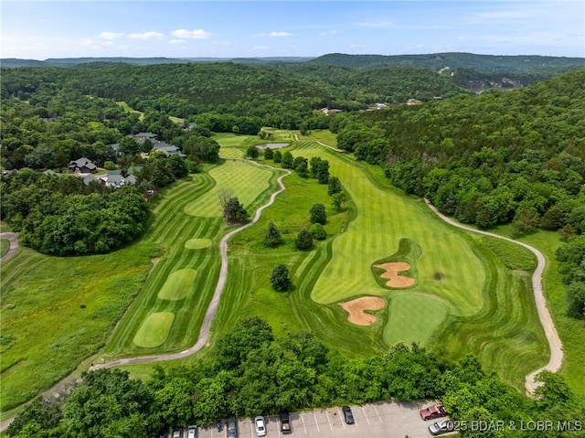 7 Lost Spike Ct, Camdenton, MO 65020 - aerial view of property and surrounding area featuring a golf course and a heavily wooded area