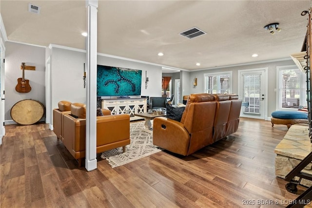 7 Lost Spike Ct, Camdenton, MO 65020 - living area featuring ornamental molding, wood finished floors, recessed lighting, and ornate columns