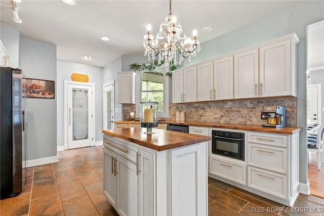 7 Lost Spike Ct, Camdenton, MO 65020 - kitchen featuring butcher block countertops, freestanding refrigerator, backsplash, white cabinets, and recessed lighting