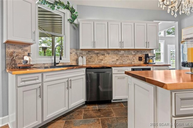 7 Lost Spike Ct, Camdenton, MO 65020 - kitchen featuring butcher block counters, dishwasher, stone tile floors, and white cabinets