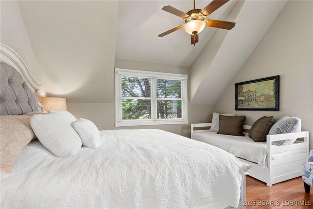 7 Lost Spike Ct, Camdenton, MO 65020 - bedroom with vaulted ceiling, wood finished floors, and ceiling fan