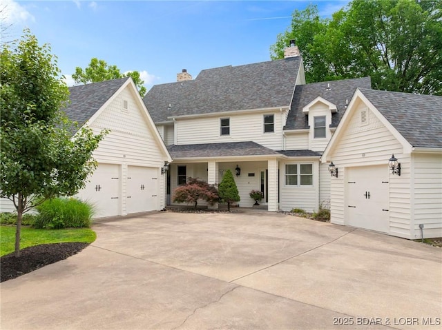 7 Lost Spike Ct, Camdenton, MO 65020 - view of front of house with driveway, a garage, and a chimney