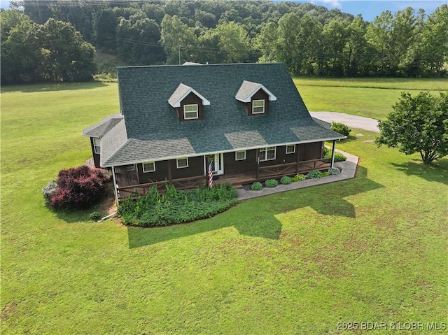 2326 Willow Creek Rd, Camdenton, MO 65020 - view of front of home featuring a front lawn, a porch, roof with shingles, and a view of trees