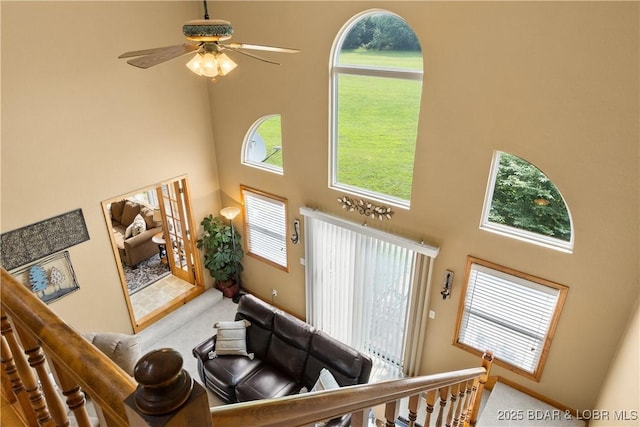 2326 Willow Creek Rd, Camdenton, MO 65020 - living room with a towering ceiling, plenty of natural light, a ceiling fan, and carpet floors