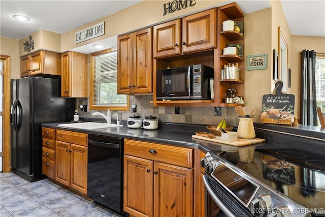 2326 Willow Creek Rd, Camdenton, MO 65020 - kitchen with black appliances, backsplash, brown cabinetry, and dark countertops