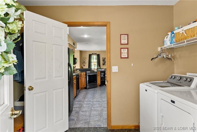 2326 Willow Creek Rd, Camdenton, MO 65020 - laundry room with separate washer and dryer and light tile patterned flooring