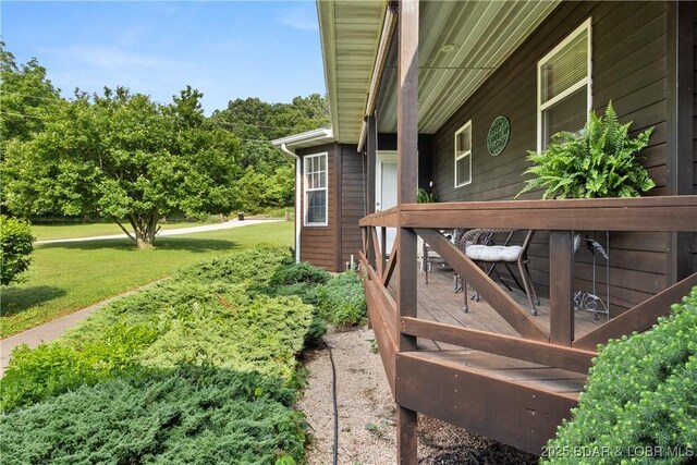 2326 Willow Creek Rd, Camdenton, MO 65020 - view of green lawn with a wooden deck
