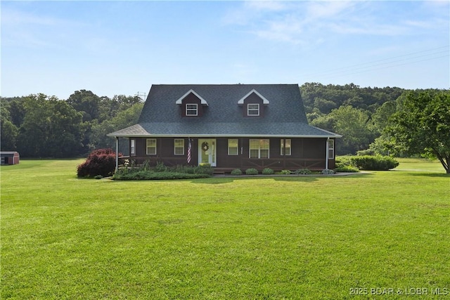 2326 Willow Creek Rd, Camdenton, MO 65020 - view of front of home featuring a porch, a front lawn, and a forest view