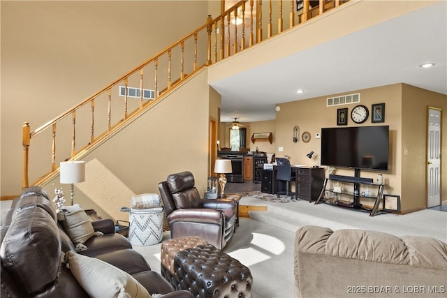 2326 Willow Creek Rd, Camdenton, MO 65020 - carpeted living room featuring stairs, recessed lighting, and a towering ceiling