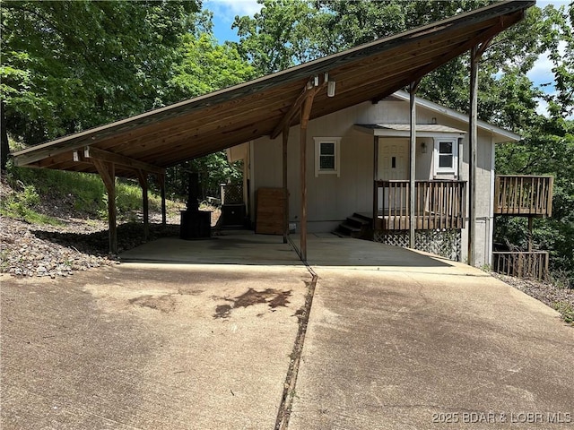 20 Barba Le Ln, Lake Ozark, MO 65049 - view of front of property featuring concrete driveway and a carport