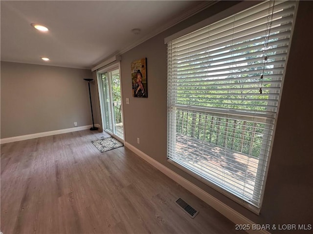 20 Barba Le Ln, Lake Ozark, MO 65049 - unfurnished room featuring wood finished floors, recessed lighting, crown molding, and a smoke detector