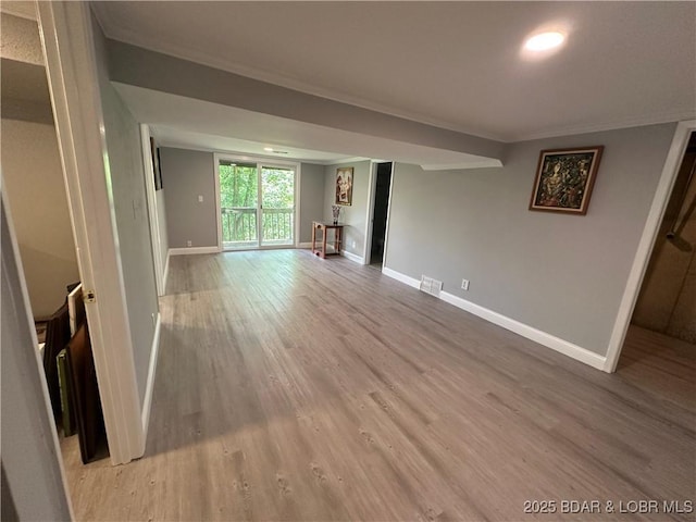 20 Barba Le Ln, Lake Ozark, MO 65049 - unfurnished living room featuring ornamental molding and light wood-style flooring