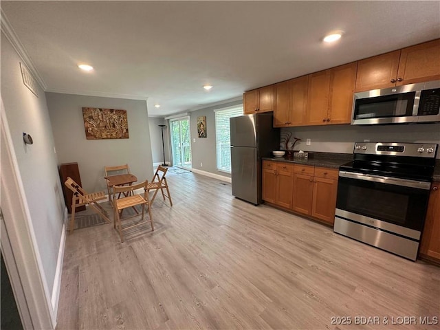20 Barba Le Ln, Lake Ozark, MO 65049 - kitchen featuring appliances with stainless steel finishes, ornamental molding, light wood-style floors, dark countertops, and recessed lighting