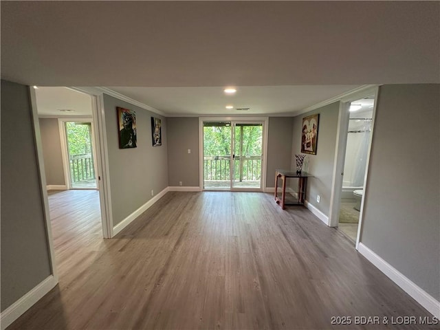 20 Barba Le Ln, Lake Ozark, MO 65049 - empty room with wood finished floors, ornamental molding, plenty of natural light, and recessed lighting