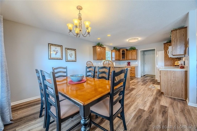 1508 Purvis Rd, Sunrise Beach, MO 65079 - dining space with light wood-style floors, a chandelier, and recessed lighting