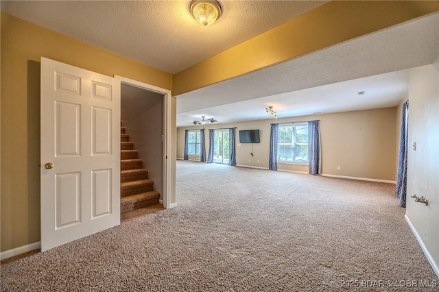 1508 Purvis Rd, Sunrise Beach, MO 65079 - carpeted spare room with stairs and a textured ceiling