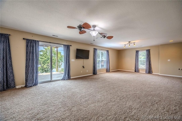 1508 Purvis Rd, Sunrise Beach, MO 65079 - carpeted empty room featuring a textured ceiling and a ceiling fan