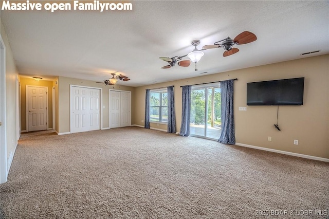1508 Purvis Rd, Sunrise Beach, MO 65079 - unfurnished living room featuring a ceiling fan and carpet flooring