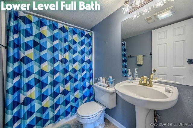 1508 Purvis Rd, Sunrise Beach, MO 65079 - bathroom with a shower with shower curtain, a textured ceiling, and tile patterned floors