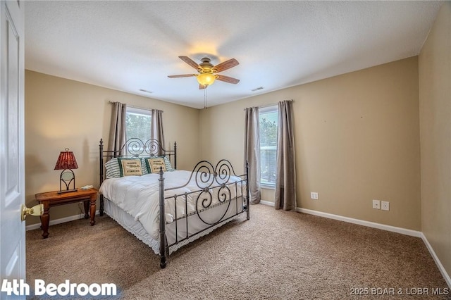1508 Purvis Rd, Sunrise Beach, MO 65079 - bedroom featuring multiple windows, carpet, and ceiling fan