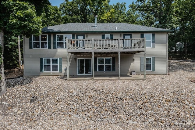 1508 Purvis Rd, Sunrise Beach, MO 65079 - back of property with a wooden deck, a patio area, and a shingled roof