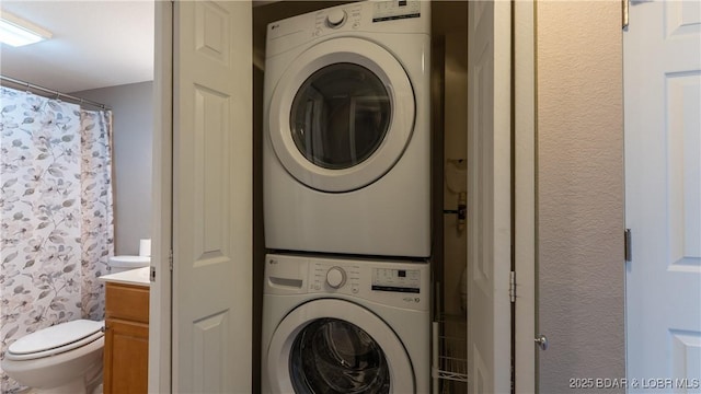 150 Southwood Shores Dr Unit 71-1B, Lake Ozark, MO 65049 - laundry area featuring stacked washer / dryer