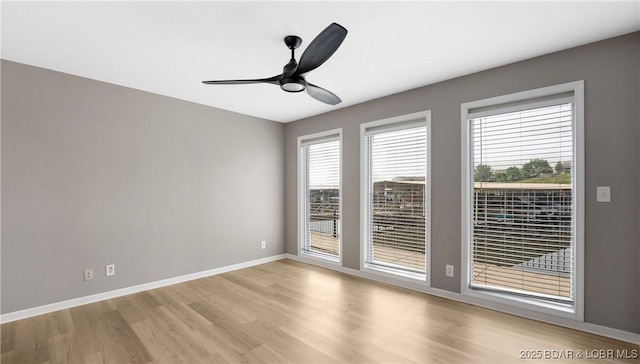 150 Southwood Shores Dr Unit 71-1B, Lake Ozark, MO 65049 - spare room featuring light wood finished floors, healthy amount of natural light, and ceiling fan
