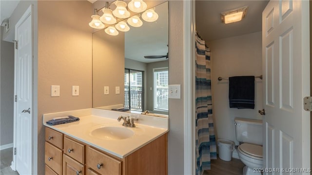 150 Southwood Shores Dr Unit 71-1B, Lake Ozark, MO 65049 - bathroom featuring vanity, a ceiling fan, wood finished floors, and a shower with shower curtain