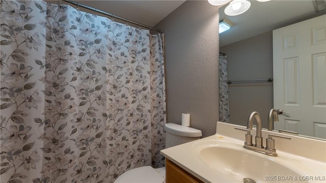 150 Southwood Shores Dr Unit 71-1B, Lake Ozark, MO 65049 - full bath featuring vanity, a textured wall, and curtained shower