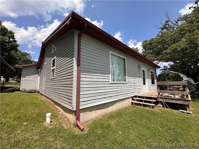 25372 Loon Blvd, Warsaw, MO 65355 - view of home's exterior with a wooden deck and a yard