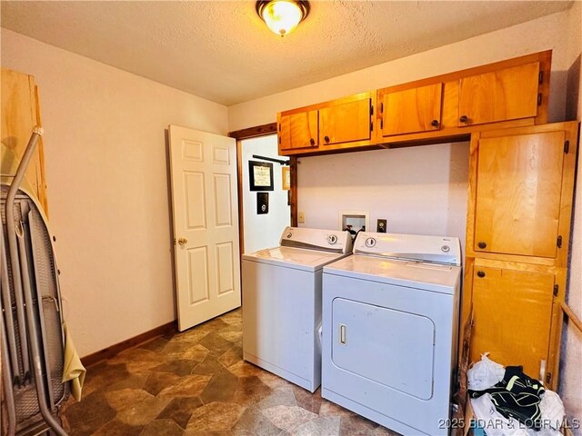 25372 Loon Blvd, Warsaw, MO 65355 - laundry area with cabinet space, washer and dryer, a textured ceiling, and stone finish flooring