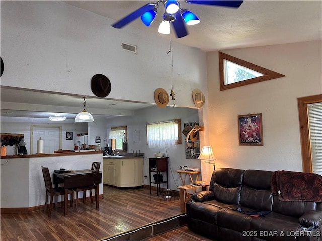 25372 Loon Blvd, Warsaw, MO 65355 - living area featuring ceiling fan, wood finished floors, and a high ceiling