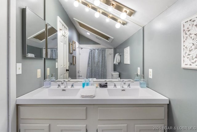 5940 Baydy Peak Rd Unit 1232, Osage Beach, MO 65065 - bathroom with double vanity, vaulted ceiling, and a shower with curtain
