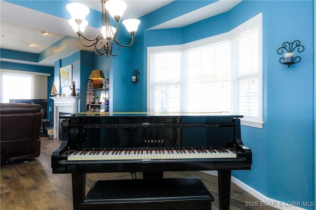 607 E Harbour Towne Dr Unit E-607, Lake Ozark, MO 65049 - living area with a chandelier, dark wood finished floors, and a fireplace