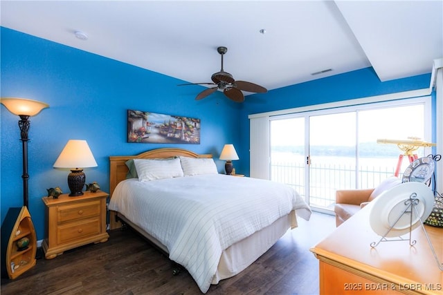 607 E Harbour Towne Dr Unit E-607, Lake Ozark, MO 65049 - bedroom with access to exterior, dark wood-style flooring, and a water view