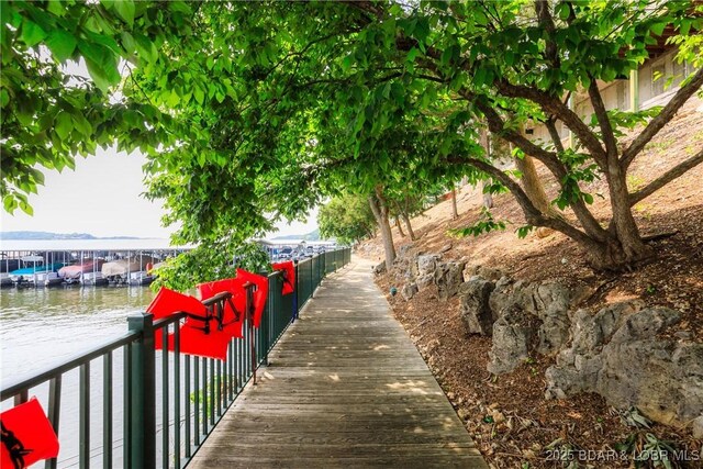 607 E Harbour Towne Dr Unit E-607, Lake Ozark, MO 65049 - view of home's community featuring a water view and a dock